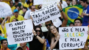 Demonstrators show off their protest posters