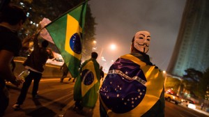 Protesters draped in Brazilian flags take to streets in Sao Paulo